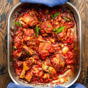 Metal roasting pan with pollo alla potentina.
