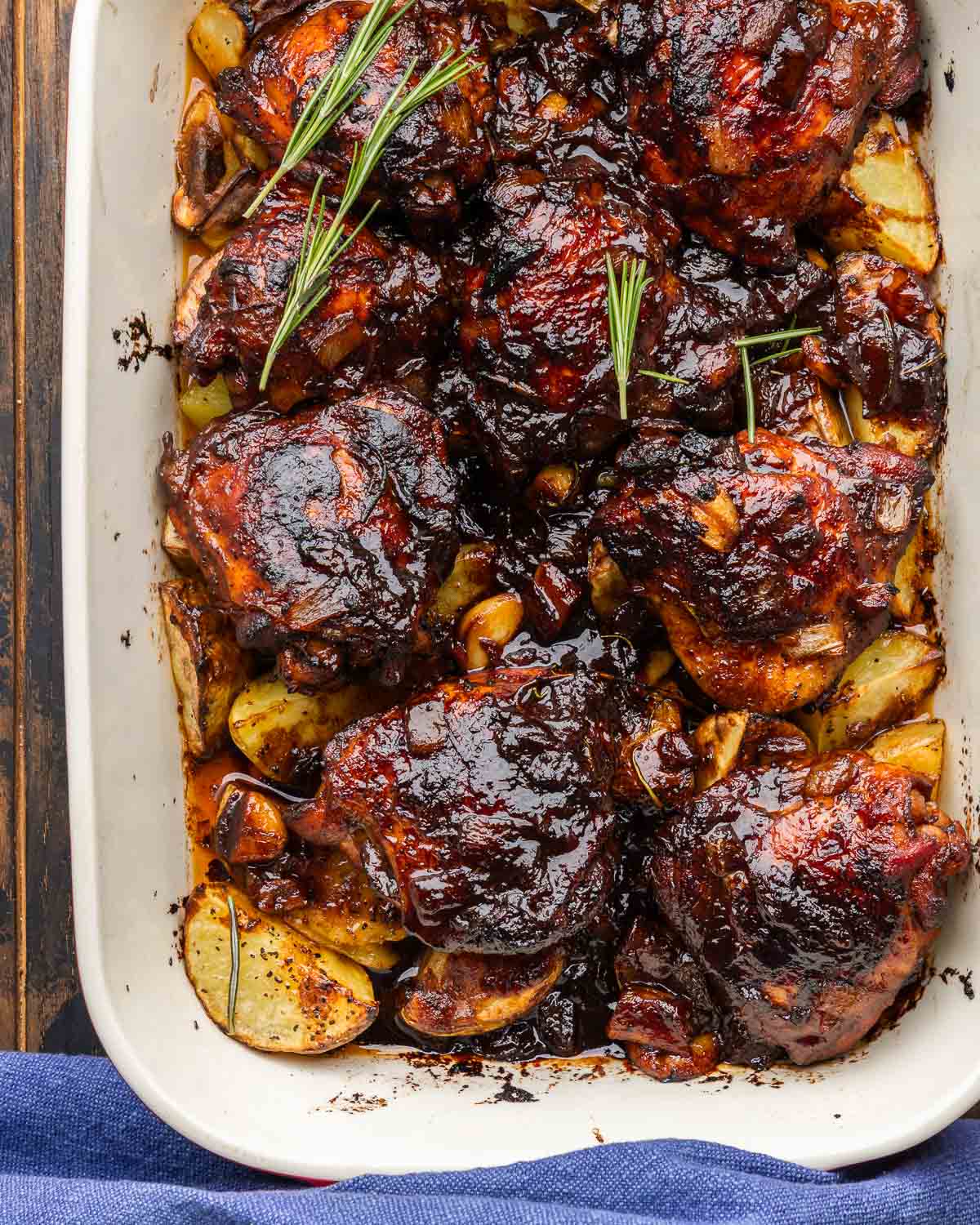 Large baking dish with balsamic chicken and potatoes.
