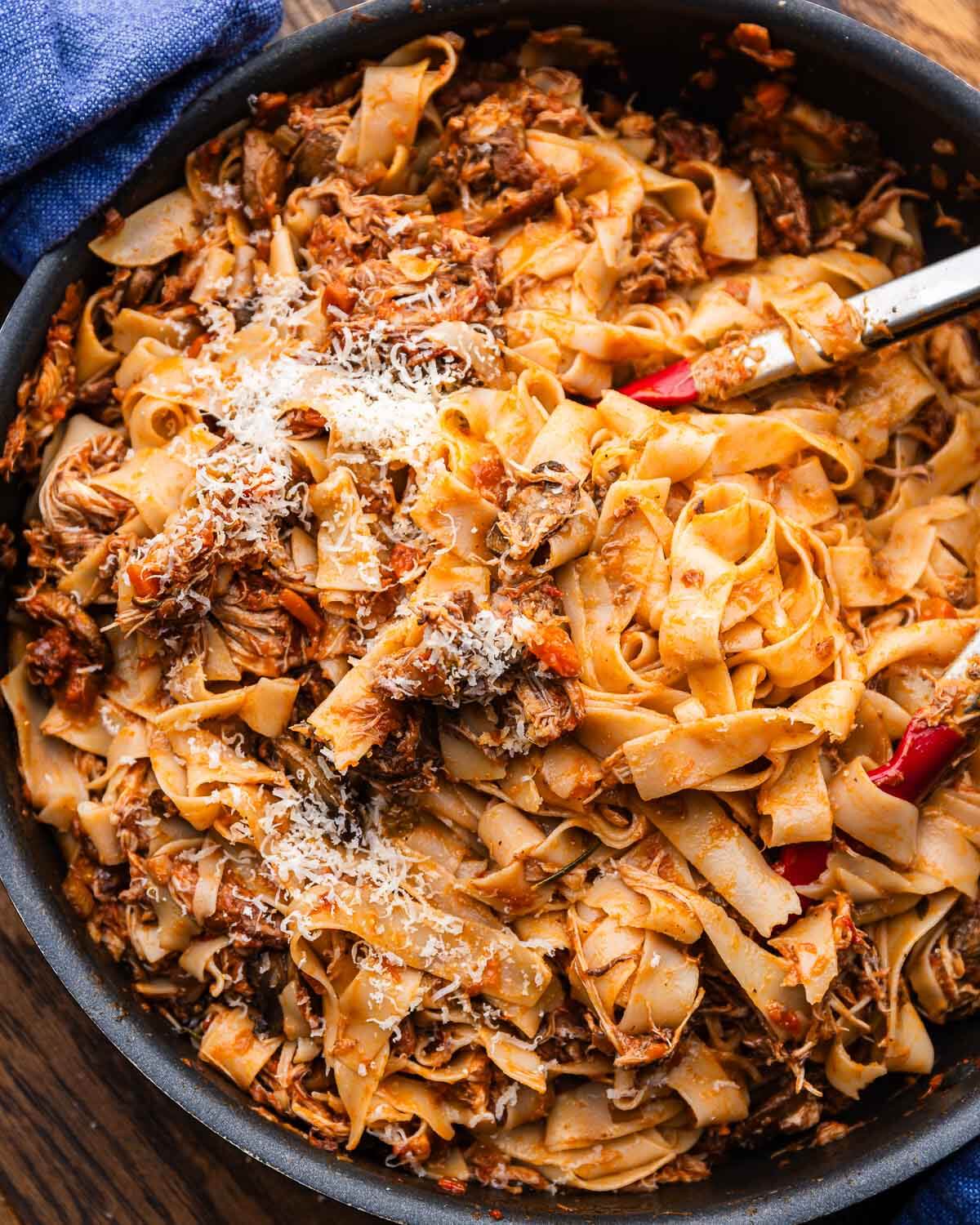 Hearty chicken mushroom ragu pappardelle topped with grated parmigiano reggiano.