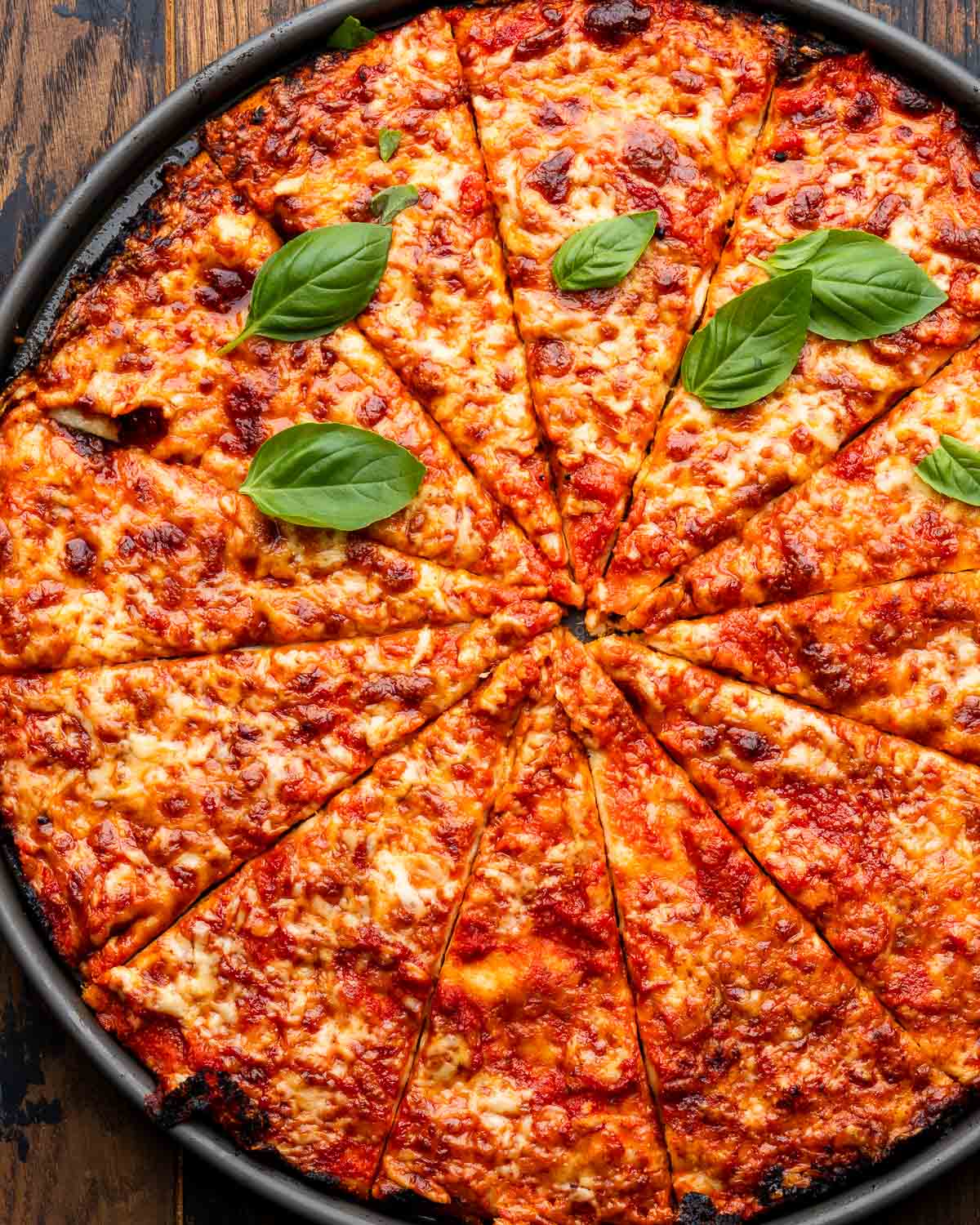 Large pan pizza cut into 12 pieces.