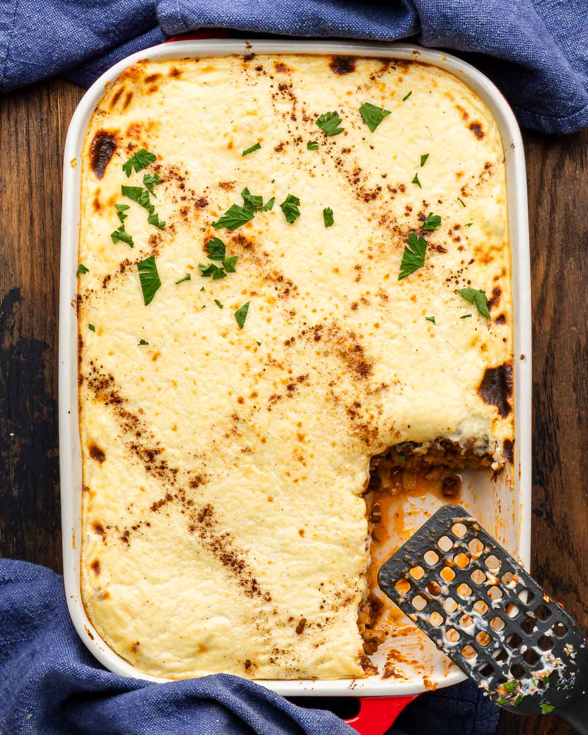 Large baking dish of pastitsio on table.