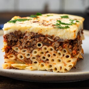 Large slice of pastitsio on plate.