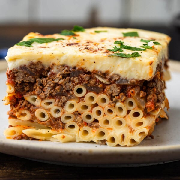 Large slice of pastitsio on plate.